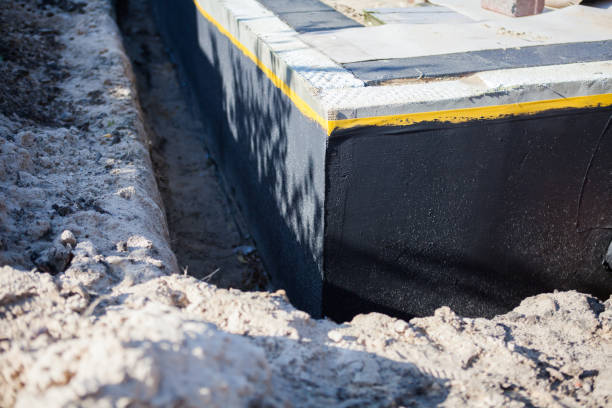 Professional Basement Waterproofing technician working in Wartburg, TN